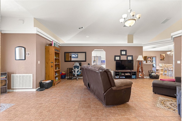 tiled living room featuring a chandelier