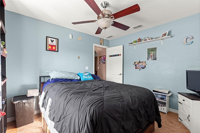 bedroom featuring light tile patterned floors and ceiling fan
