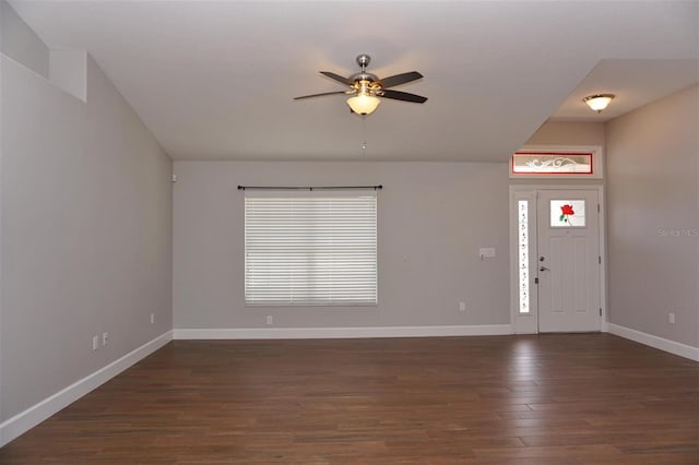 foyer entrance featuring dark wood-type flooring and ceiling fan