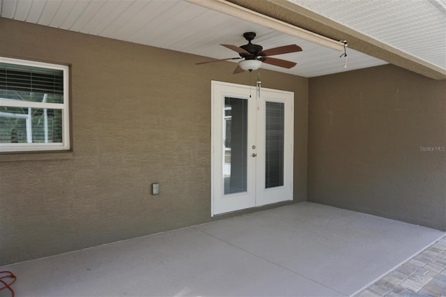 view of patio with french doors and ceiling fan