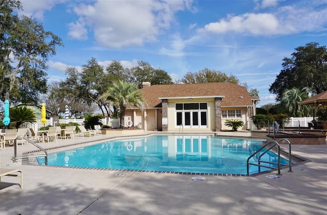 view of swimming pool with a patio area