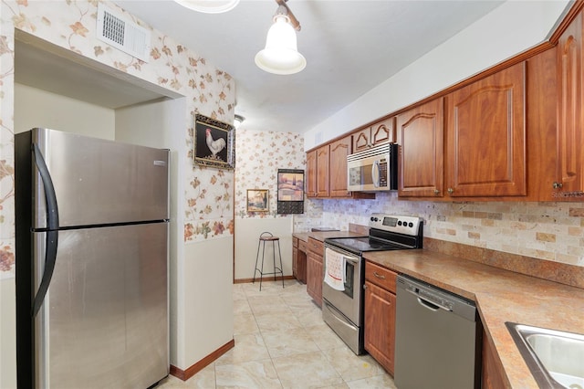 kitchen featuring stainless steel appliances and sink