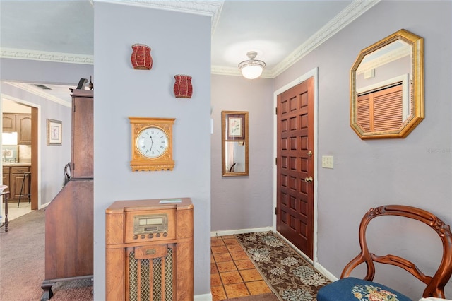 foyer with tile patterned flooring and ornamental molding