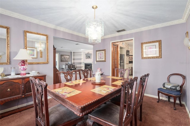 dining room with ornamental molding, a chandelier, and dark colored carpet