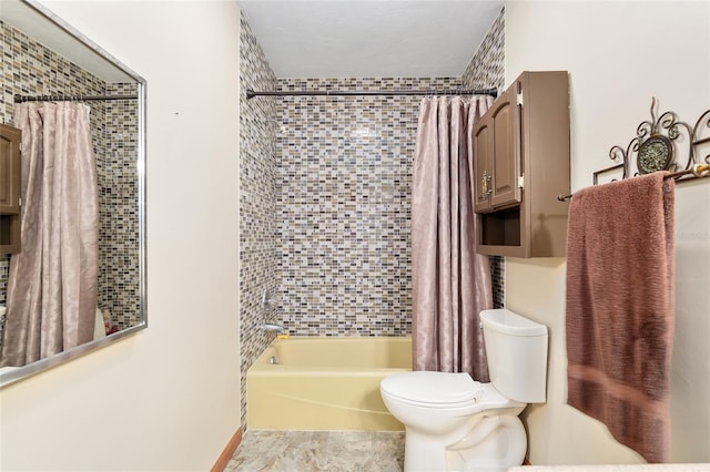 bathroom with shower / tub combo with curtain and toilet