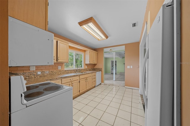 kitchen with sink, white appliances, light tile patterned floors, tasteful backsplash, and light brown cabinetry