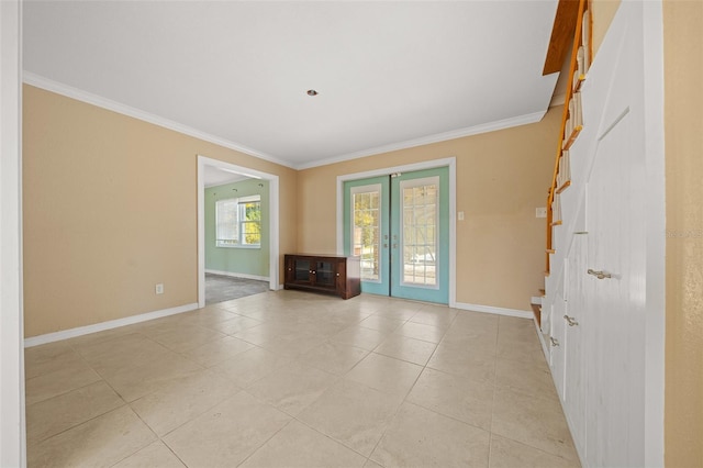 tiled spare room with french doors and ornamental molding