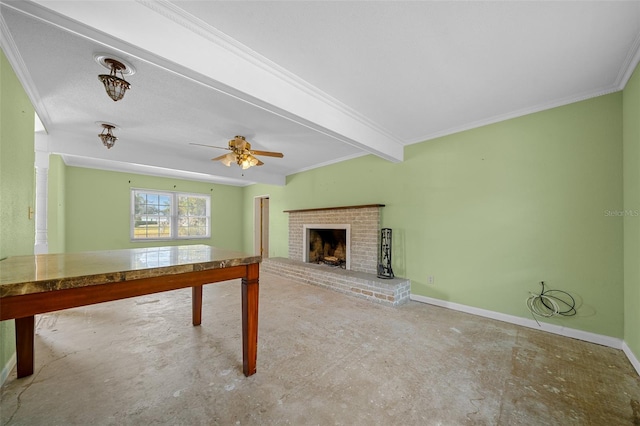 rec room featuring beamed ceiling, ornamental molding, a brick fireplace, and ceiling fan