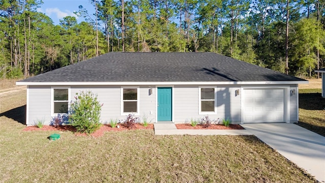 ranch-style home with a garage and a front yard