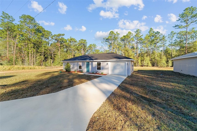 ranch-style house featuring a garage and a front lawn