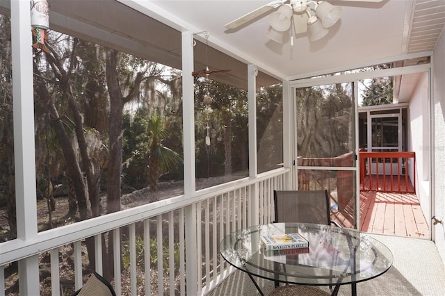 sunroom / solarium with ceiling fan