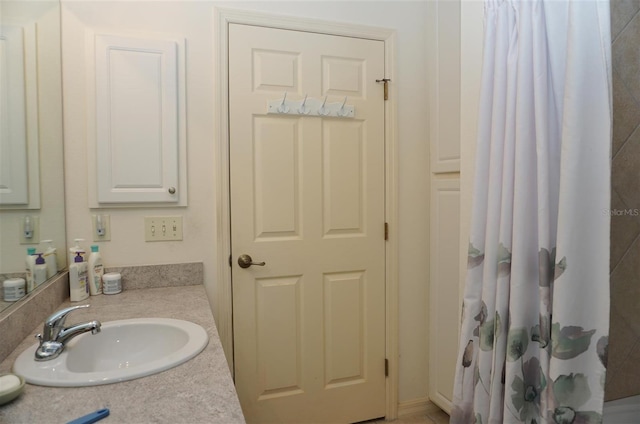 bathroom with vanity and a shower with curtain