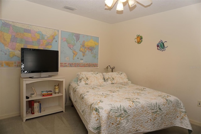 bedroom with ceiling fan and carpet flooring