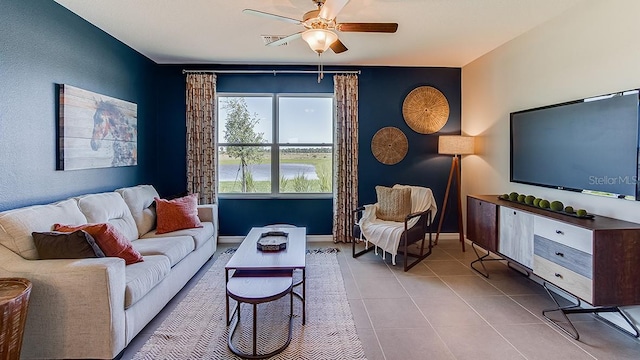 living room with light tile patterned flooring and ceiling fan