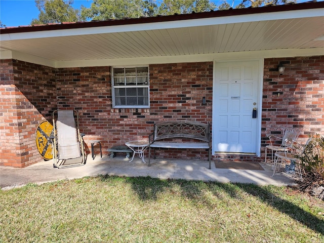 entrance to property featuring a patio area