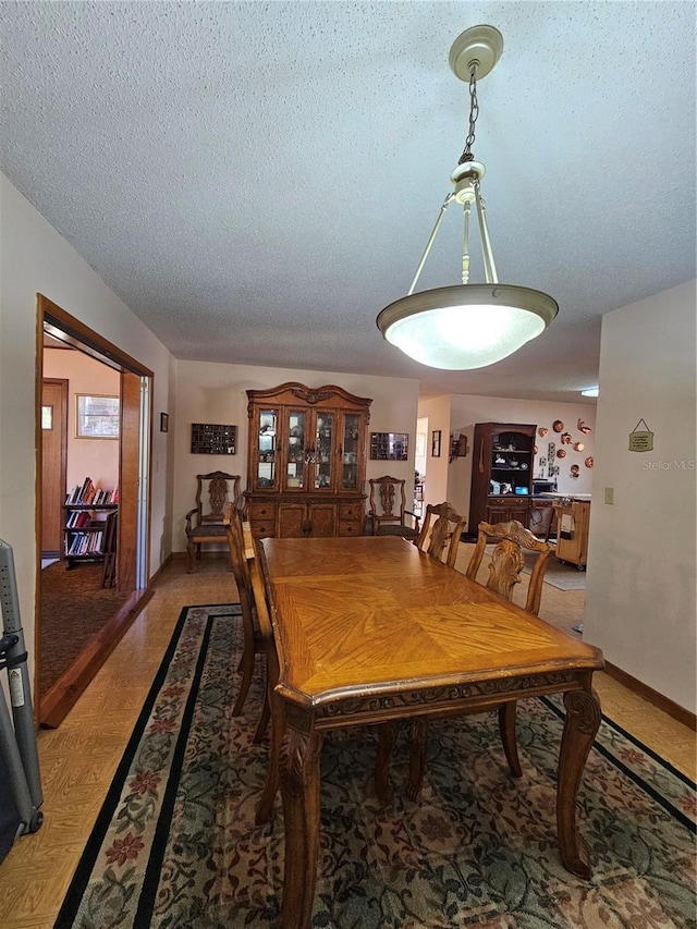 dining area with a textured ceiling