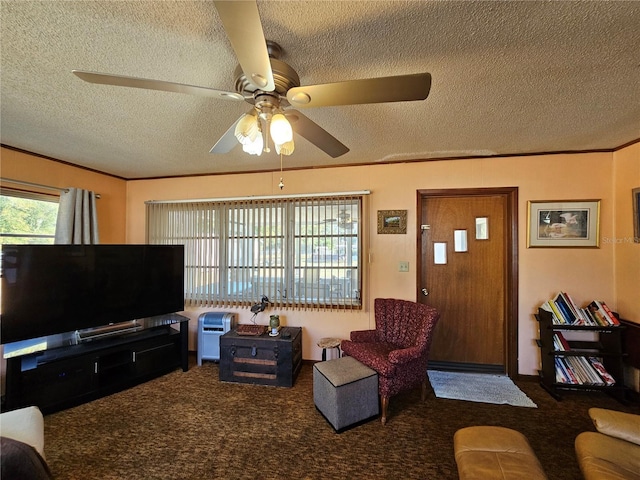 carpeted living room featuring ceiling fan, ornamental molding, and a textured ceiling