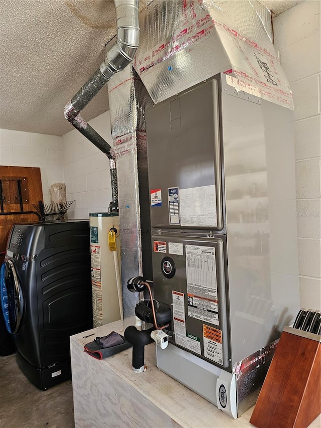 utility room with heating unit, washer / dryer, and gas water heater