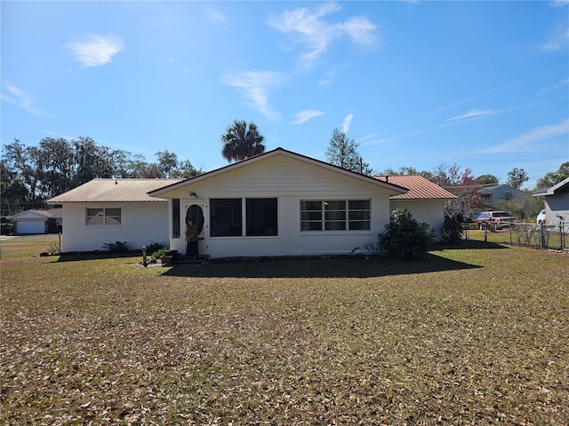 single story home featuring a front yard