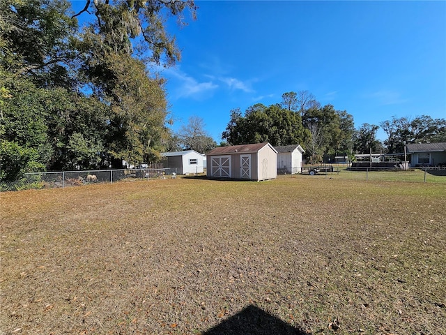 view of yard featuring a storage unit