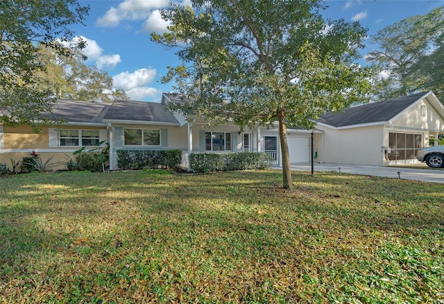 single story home featuring a garage and a front lawn