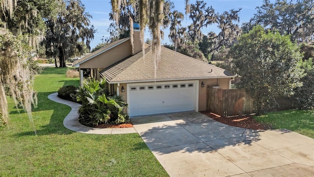 view of home's exterior with a garage and a yard