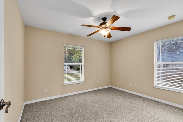 empty room with carpet and ceiling fan