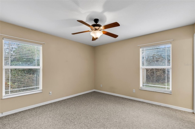 unfurnished room with ceiling fan and carpet floors