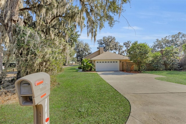 view of front of house featuring a garage and a front yard