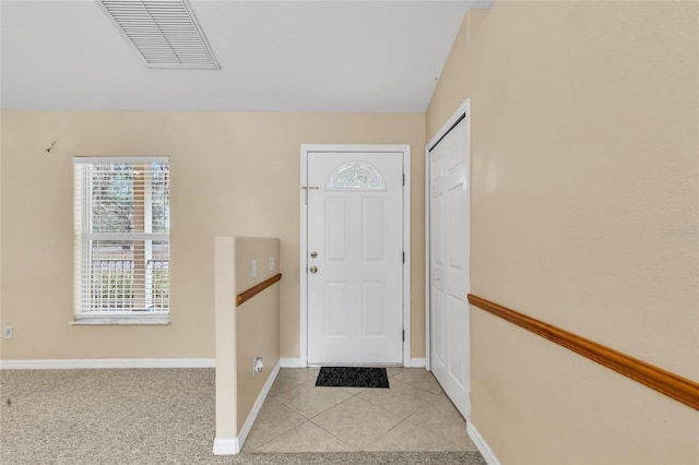 foyer featuring light tile patterned floors