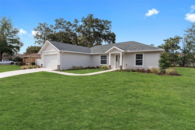 single story home with a garage and a front lawn