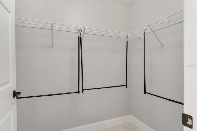 1302 NE 22nd Ave, Ocala, FL 34470 - walk in closet featuring light tile patterned flooring