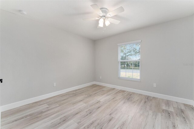 1302 NE 22nd Ave, Ocala, FL 34470 - empty room with ceiling fan and light wood-type flooring
