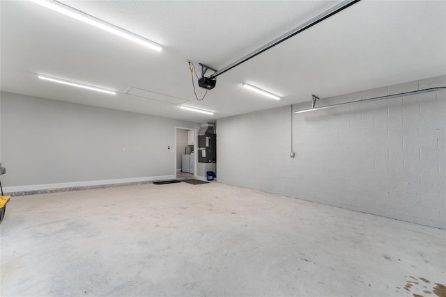 1302 NE 22nd Ave, Ocala, FL 34470 - garage with a garage door opener and washer / clothes dryer