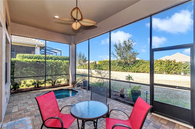 sunroom / solarium with ceiling fan