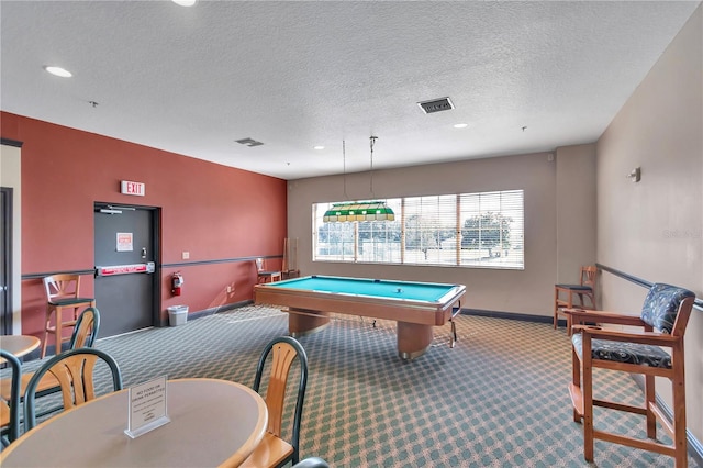 game room with carpet, a textured ceiling, and billiards