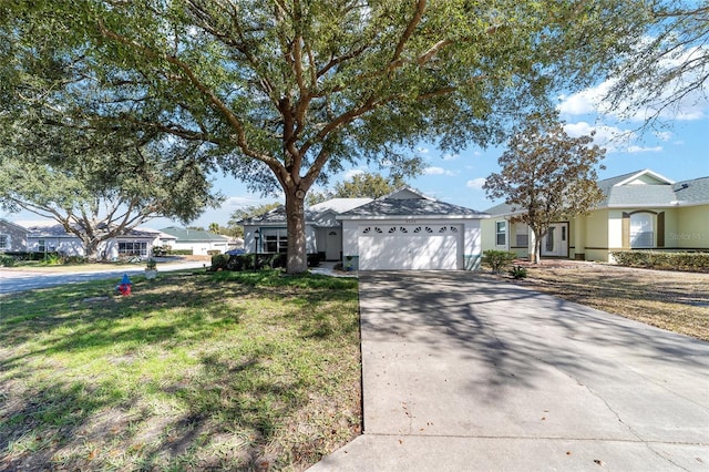 ranch-style house with a garage and a front yard