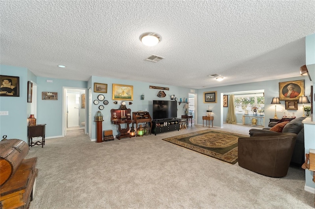 living room featuring light carpet and a textured ceiling