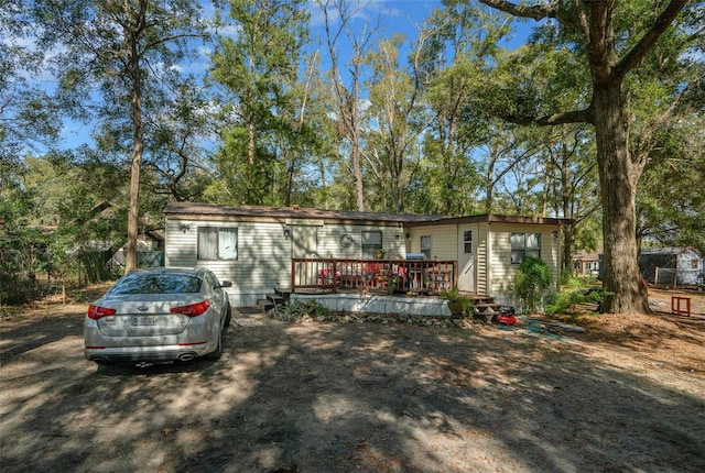 view of front of property featuring a wooden deck