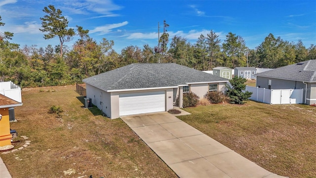 single story home featuring a garage, a front lawn, and central air condition unit