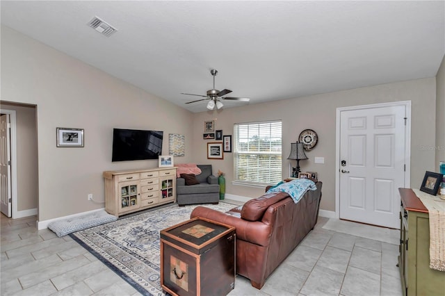 tiled living room featuring vaulted ceiling and ceiling fan