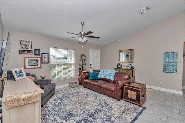 living room featuring vaulted ceiling and ceiling fan