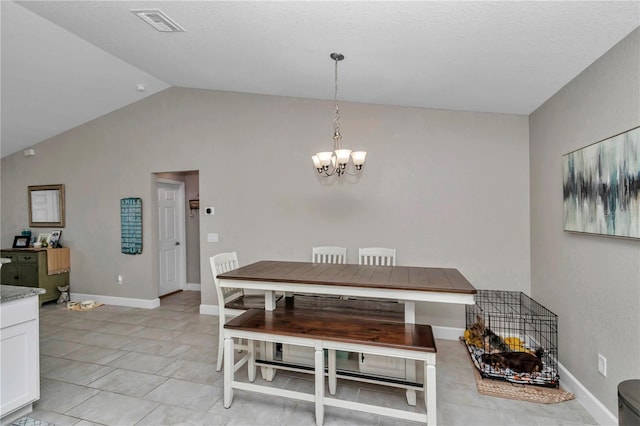 dining room with vaulted ceiling and a chandelier