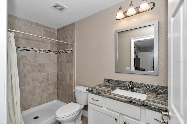 bathroom with vanity, a shower with curtain, and toilet