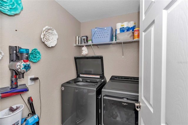 washroom featuring separate washer and dryer