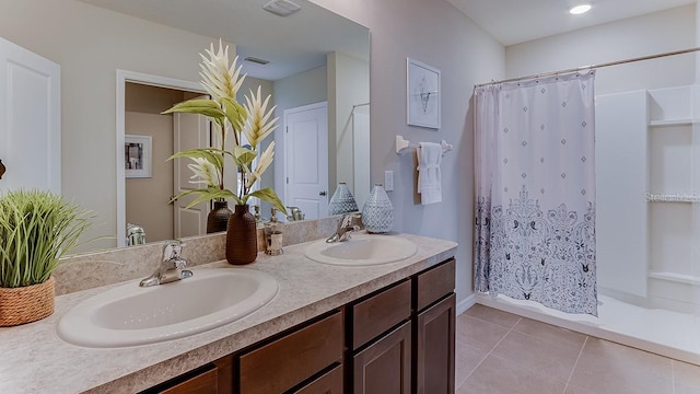 bathroom featuring a shower with curtain, tile patterned floors, and vanity