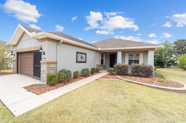 view of front of home featuring a garage and a front yard