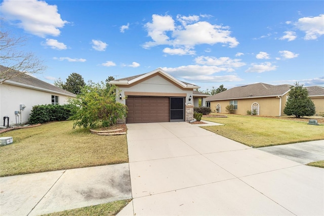 single story home featuring a garage and a front yard