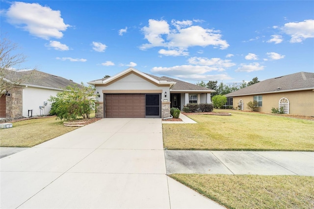 ranch-style home with a garage and a front lawn