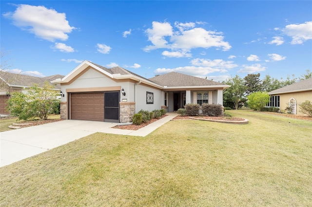 view of front of home with a garage and a front lawn